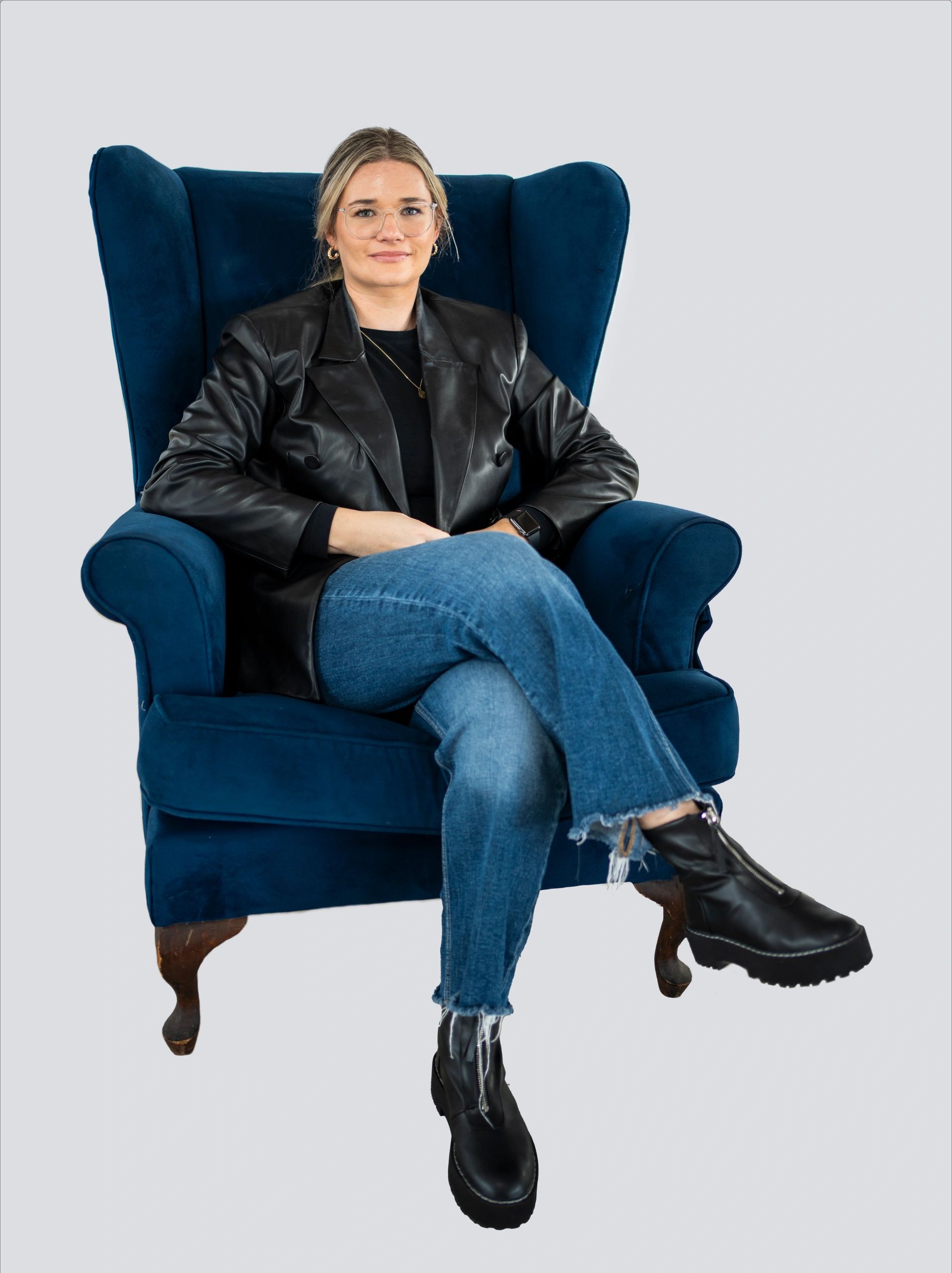 Young woman model seated in minimalist fashion portrait