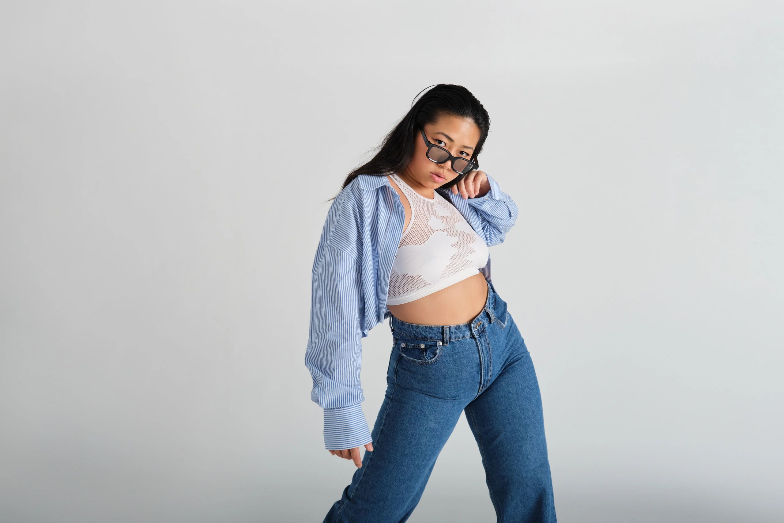 Studio fashion portrait with confident streetwear styling
